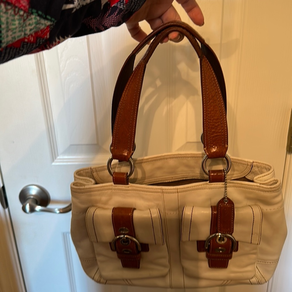 Coach bag winter white and camel leather,needs a pro to leather clean & make new